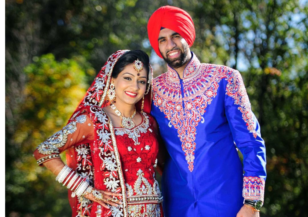 Contrasting Red Lehenga and Blue Sherwani