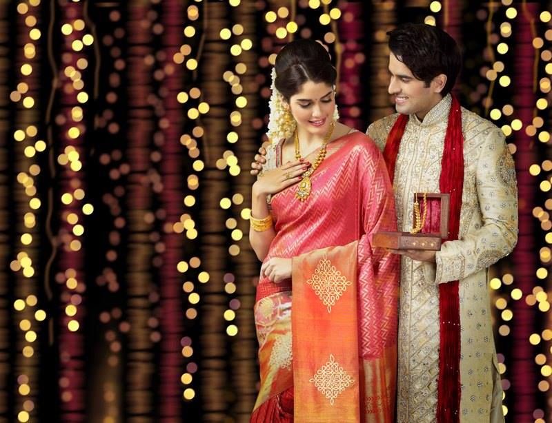 Try the Most Glamorous and Trendy Couple Outfits to Shine on Your Wedding Day Golden Kanjivaram Saree and Golden Sherwani