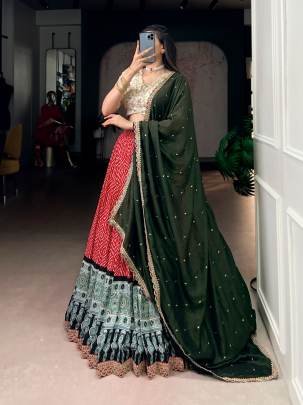 A beautiful blend of Bandhej and Ajrakh prints on soft rayon enhanced with delicate sequins, thread embroidery, and elegant lace detailing  LNB1416RED