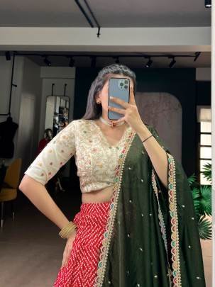 A beautiful blend of Bandhej and Ajrakh prints on soft rayon enhanced with delicate sequins, thread embroidery, and elegant lace detailing  LNB1416RED