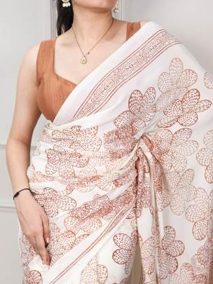 Classic beauty redefined with its silky smooth texture and artistic floral detailing, this saree is the perfect blend of tradition and trend YNF7210PE