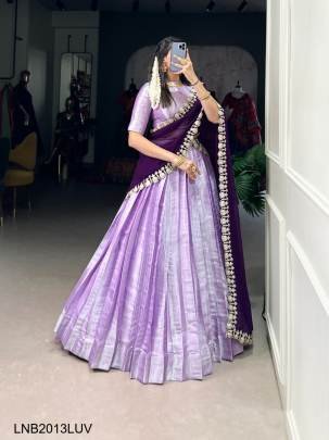 Lavender Wearing a Jacquard lehenga choli is not just about donning attire, where traditional motifs meet modern silhouettes LNB2013LUV