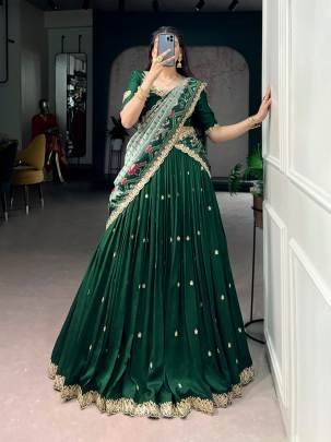 Rich Vichitra silk graceful flair and the timeless charm of Tussar silk come together to create a lehenga that speaks pure sophistication LNB1204GRN