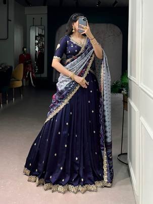 Rich Vichitra silk graceful flair and the timeless charm of Tussar silk come together to create a lehenga that speaks pure sophistication LNB1204NBL