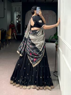 Rich Vichitra silk graceful flair and the timeless charm of Tussar silk come together to create a lehenga that speaks pure sophistication LNB1204BLK