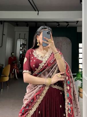 Rich Vichitra silk graceful flair and the timeless charm of Tussar silk come together to create a lehenga that speaks pure sophistication LNB1204MRN