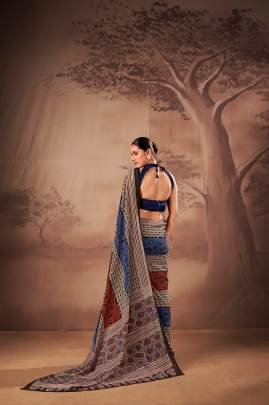 Soft elegance meets everyday grace in this beautifully printed poly mal cotton saree YNF7201NBL
