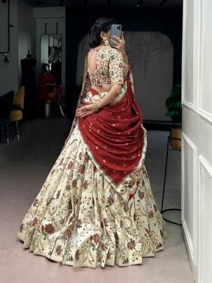 Soft tasar silk drape with radiant foil motifs a lehenga that shines with understated luxury  LNB1256OWT