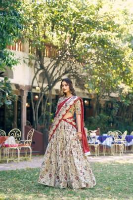 Soft tasar silk drape with radiant foil motifs    a lehenga that shines with understated luxury LNB1256OWT