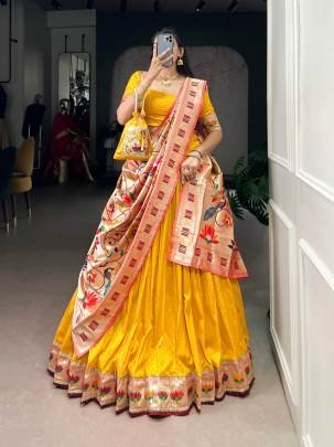 This Silk Paithani lehenga choli is where traditional zari weaving meets graceful lace borders crafted for moments that deserve royalty LNB2031YLW