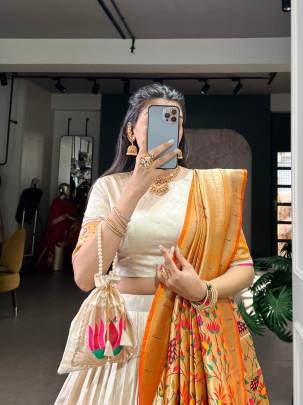 This Silk Paithani lehenga choli is where traditional zari weaving meets graceful lace borders crafted for moments that deserve royalty LNB2031YLW