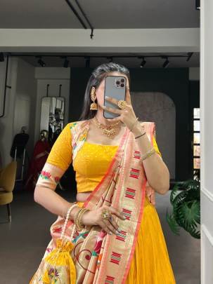 This Silk Paithani lehenga choli is where traditional zari weaving meets graceful lace borders crafted for moments that deserve royalty LNB2031YLW